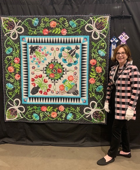 Nancy Arseneault and her quilt "Isn't it Romantic?"